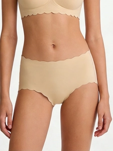 Detail view of seamless scalloped edges and breathable fabric on nude comfort panties