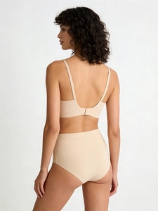 Rear view of a beige seamless bra and high-waisted underwear set with slim straps