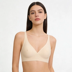 Detail of nude seamless bra with V-neck, wide straps and ripple support structure