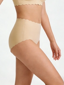 Detail of nude seamless high waist panties with wavy edges and firm fit texture