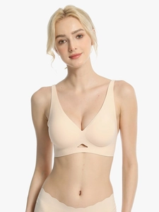 Close-up of the seamless nude V-neck bra showing unique triangular cutout detail