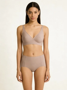 Detail showing seamless V-neck bra and high waist panties set in soft nude color