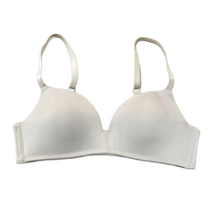 Minimalist seamless wireless bra in cream white with adjustable straps and smooth finish