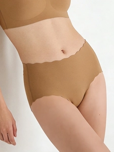 Close-up of caramel seamless panties with laser-cut wavy edges on high-stretch fabric