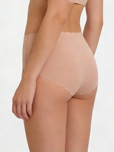 Close-up of nude seamless panties with wavy edges and breathable elastic fabric