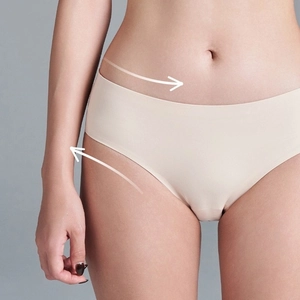 Close-up of beige seamless underwear showing elastic fit and smooth laser-cut edges