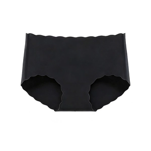 Close-up of seamless black high-waisted panties with laser-cut scalloped wave edges