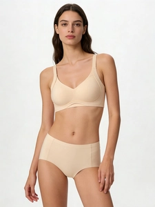 Detail of apricot wireless bra set with wide straps and high-waist seamless panties