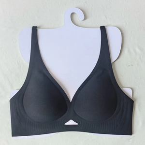 Detail of black seamless V-neck sports bra with cutout design and wide straps