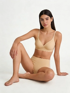 Detail of seamless wave-edge bra and high-waist panties set in nude skin color