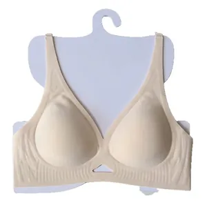 Seamless deep V-neck beige bralette with wide shoulder straps and ribbed support band