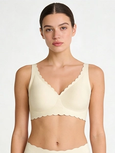 Detailed view of seamless deep V-neck bra with scalloped edges and soft jelly support