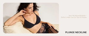 Detail of a black seamless deep V-neck bralette shown on a model in a lifestyle setting