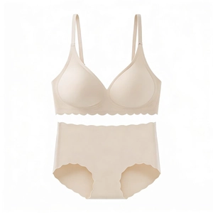 Detail view of seamless wavy scalloped edges and smooth fabric on nude bra set