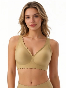 Detail of seamless deep V-neck bra with wavy edges and soft jelly support in khaki color