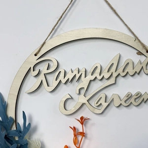 Wooden Ramadan Kareem wreath with artificial blue and orange flowers for front door decor