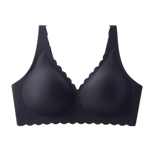 Seamless black V-neck deep-cut bra with soft support and wavy laser-cut edges