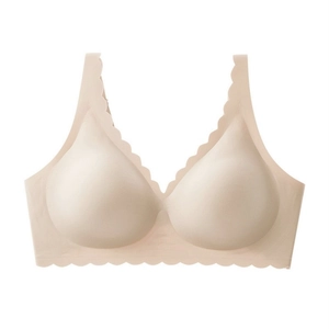 Detail showing the seamless scalloped edges and soft jelly support of this nude bra
