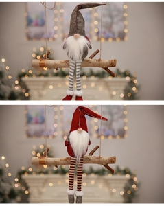 Detail of Christmas gnomes with long striped legs and pointy hats in a warm holiday setting