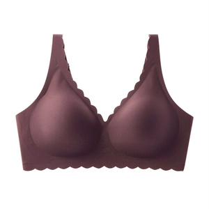 Detail of plum seamless bra showing scalloped wavy edges and smooth elastic fabric