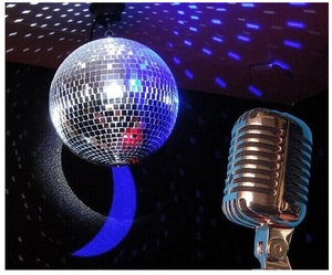 Hanging mirror disco ball with square tiles and vintage microphone for party atmosphere