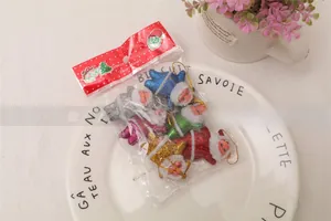 Set of six glittery Santa Claus Christmas tree ornaments in various colors with hanging loops