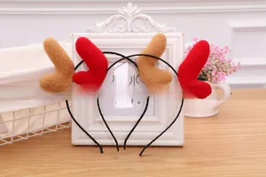 Detail of Christmas reindeer antler headbands in red and brown plush material