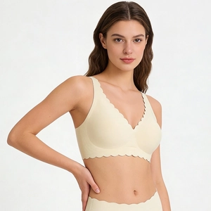 Seamless V-neck cream bra with scalloped edges and wireless support for women