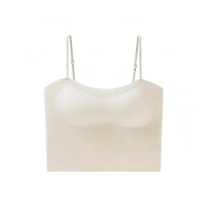 Detail view of seamless beige camisole bra showing thin straps and metal adjustment buckles
