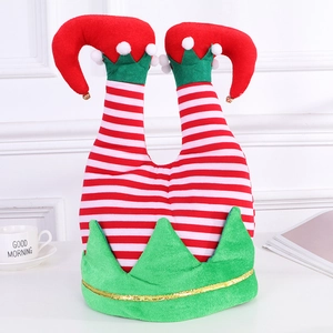 Detail of Christmas elf leg hat featuring red white stripes and gold bells on a table