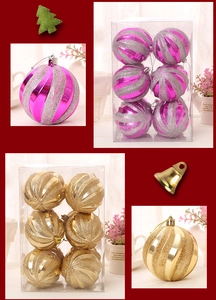 Detail of Christmas balls set with pink and gold glitter spiral texture in gift box