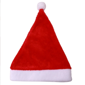 Classic red plush Christmas hat with white fur trim and pompom for festive holiday decor