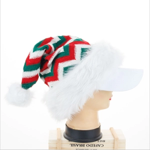 Knitted Christmas hat with red and green zig-zag patterns and white faux fur brim visor