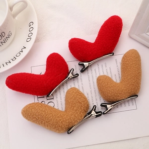 Set of 4 plush heart hair clips in red and tan faux fur with silver alligator clips