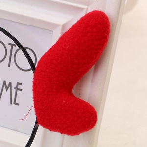Detailed close-up showing the soft sherpa fleece texture of the red Christmas antler headband