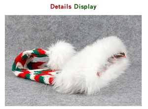 Detail display of festive red and green knitted Christmas hat with white faux fur trim