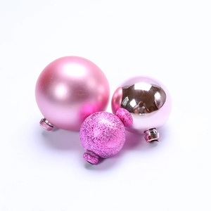 Pink decorative cake topper spheres in matte, glitter, and metallic mirror finishes