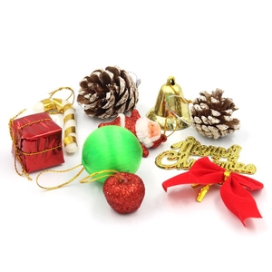 Assorted Christmas tree ornaments featuring pine cones, bells, bows and gift boxes