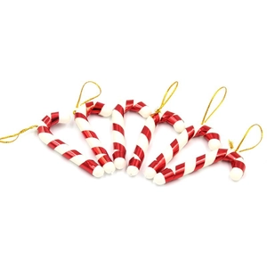 Close-up of six red and white candy cane Christmas tree hanging ornaments with gold strings