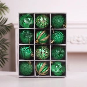 Set of 12 green Christmas ball ornaments with varied textures in a clear display box