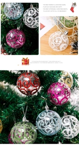 Detail of transparent PET Christmas balls with colorful glitter spiral patterns on tree