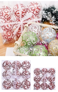 Detail of transparent PET Christmas balls with glitter spiral patterns in a display box