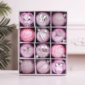 Detail of 12pcs pink Christmas ornaments with glitter, threaded and scaled textures in a box