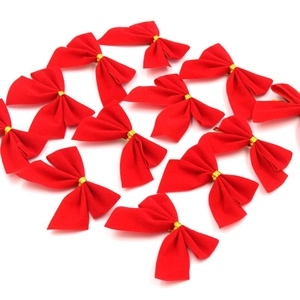 Set of decorative red velvet bows with gold twist ties for Christmas tree decoration