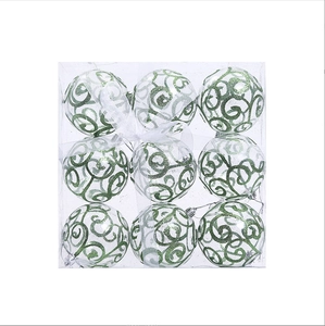Set of 9 transparent PET Christmas ornaments with green glitter swirls in a gift box