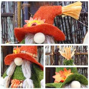 Detail showing plush harvest gnome hat with autumn maple leaf and straw decoration