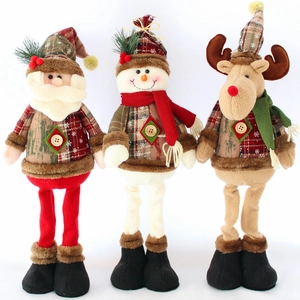 Three plush Christmas dolls featuring Santa Claus, a snowman, and a reindeer with long legs