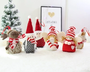 Close-up of assorted plush Santa and reindeer Christmas ornaments with knitted textures