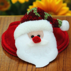 Detailed close-up of a Santa Claus felt accessory with knitted hat for Christmas decor