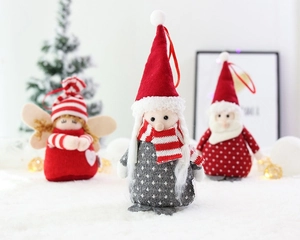 Three plush Christmas gnome ornaments with red and grey knit textures for tree decoration